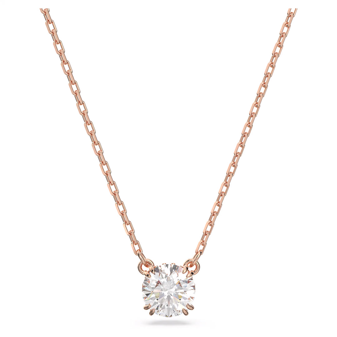 The Swarovski Stilla Necklace Pendant by Swarovski is a rose gold-tone piece featuring a delicate chain and a centrally-placed, round, brilliant-cut diamond that showcases exceptional sparkle and clarity reminiscent of high-quality zirconia.