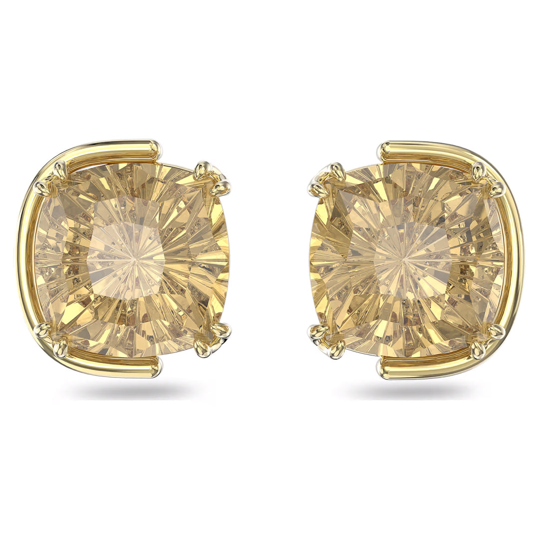 Introducing the Swarovski Harmonia Stud Earrings: a pair of gold-tone plated earrings featuring large, cushion-cut yellow gemstones. Reminiscent of classic designs, the stones are set in four-prong gold settings with intricate faceting visible. These earrings exude elegance and timeless style.