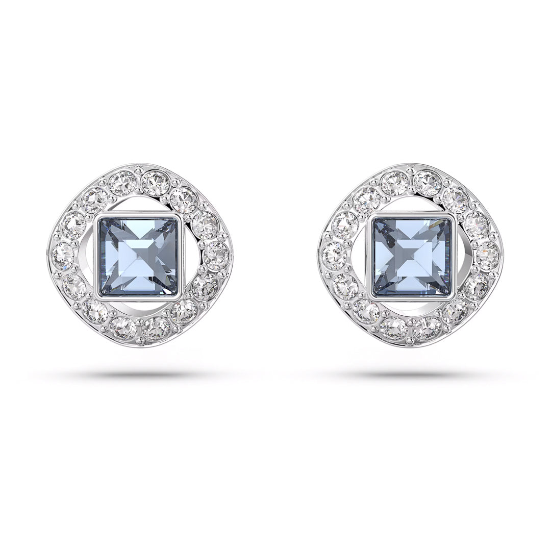 Introducing the Swarovski Angelic Stud Earrings, crafted by the renowned brand Swarovski. These elegant earrings showcase a stunning blue center stone encircled by a border of small clear crystals, all set in rhodium-plated silver, offering a sparkling and sophisticated appearance.