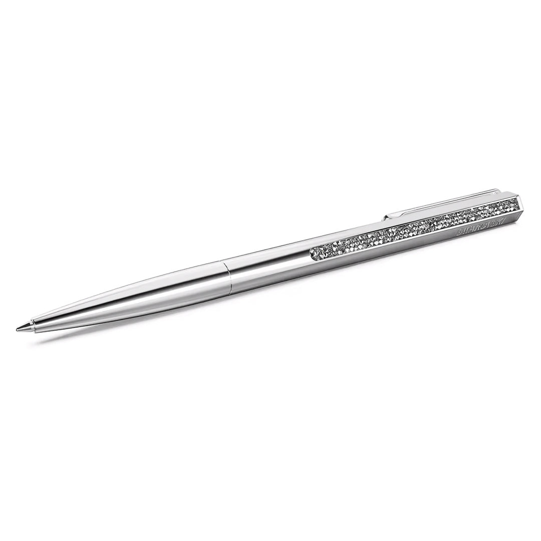 Introducing the Swarovski Crystal Shimmer Ballpoint Pen by Swarovski—a sophisticated writing instrument with a sleek silver design and shiny metallic finish. This pen is adorned with stunning Crystal Rocks, and its decorative clip pattern adds an elegant touch. It's a standout accessory typically available in exclusive Swarovski stores.