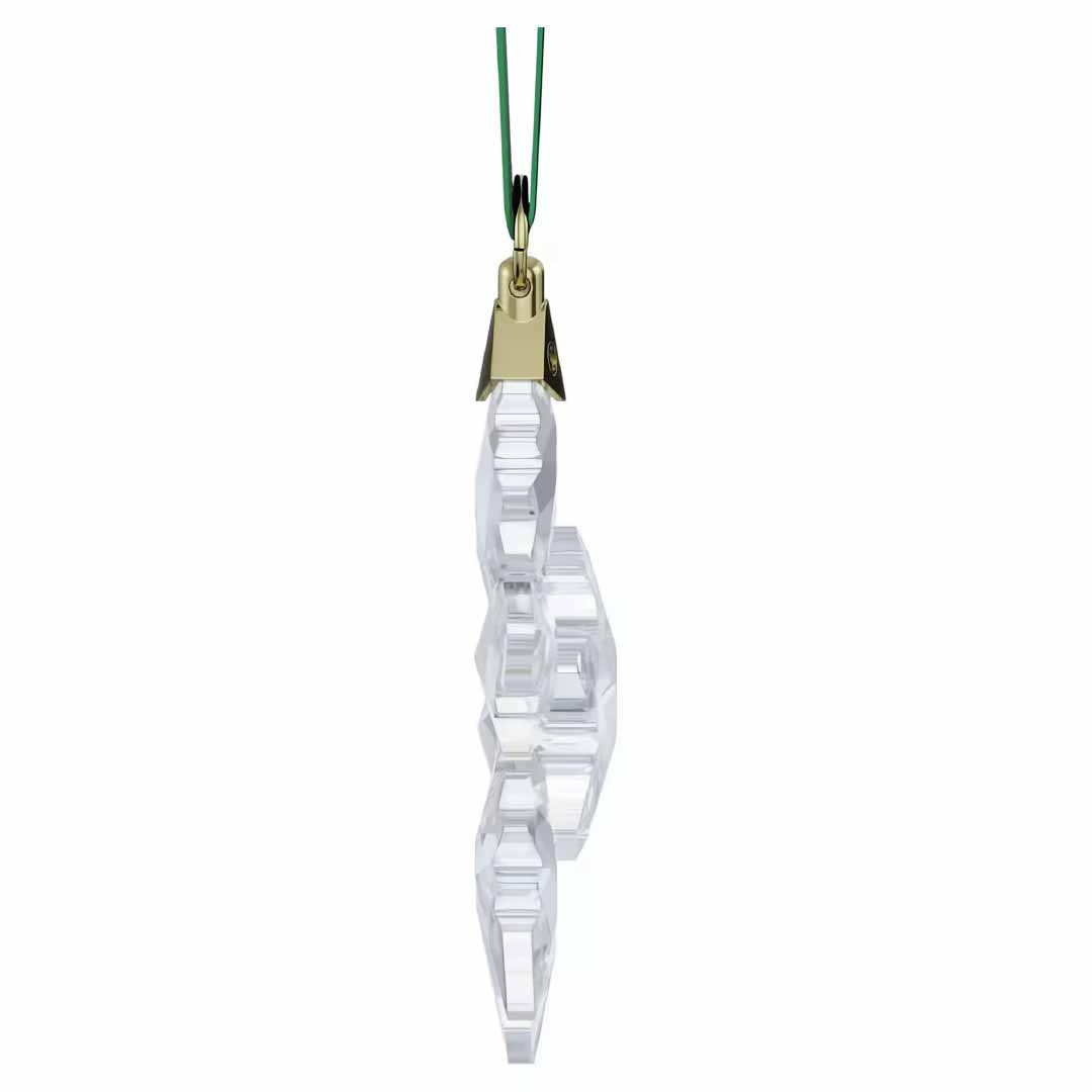 The Swarovski 2024 Annual Edition Ornament Set Home Décor showcases a beautiful crystal snowflake ornament suspended from a green string. Expertly crafted by Swarovski, it features intricate, light-reflecting facets and is enhanced with a gold-colored attachment linking it to the string. Ideal for anyone who appreciates exquisite snowflake decorations.