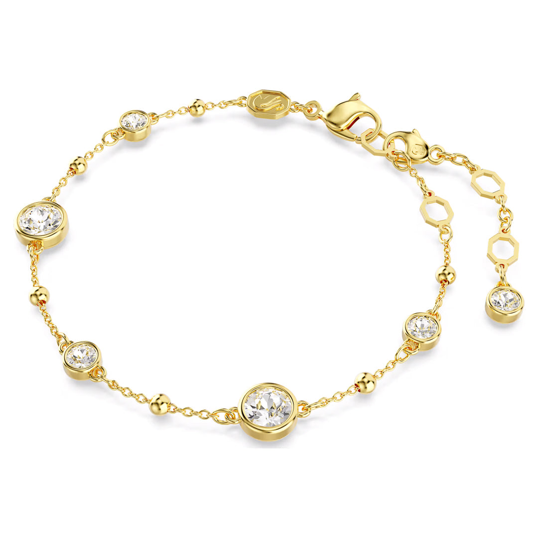 The Swarovski Imber Bracelet by Swarovski is a delicate piece featuring gold-tone plating and embellished with round-cut crystals. It includes a lobster clasp and an adjustable chain with additional charm links, making it ideal for adding elegance to any outfit.