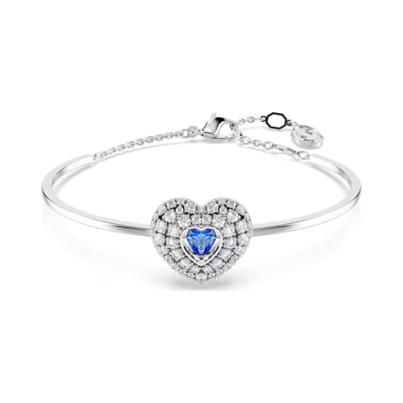The Swarovski Hyperbola Heart Bangle, a creation by Swarovski, features a heart-shaped dancing stone at its center, surrounded by smaller Swarovski Zirconia gems for a radiant sparkle. This silver bangle offers a sleek and elegant design with a simple clasp.