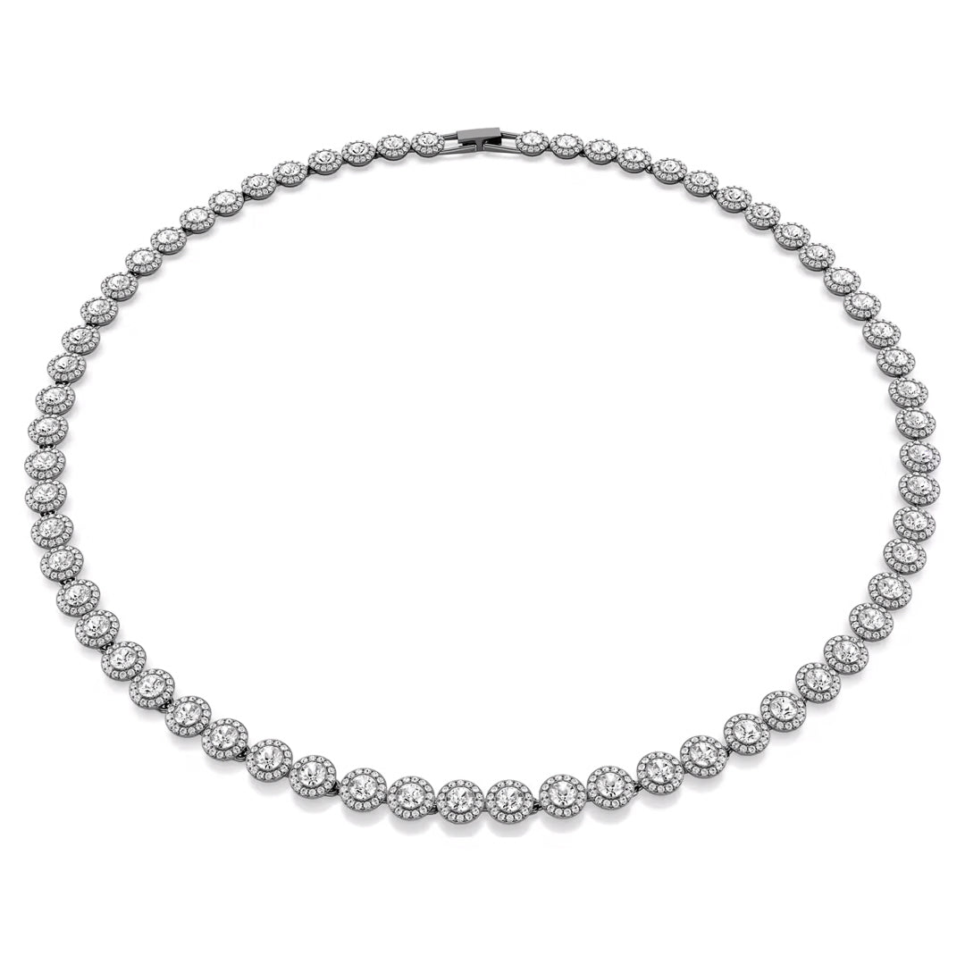 The Swarovski Una Angelic Necklace exhibits a dazzling ruthenium-plated design featuring a round diamond tennis style adorned with interconnected circular diamond clusters set in silver or white gold. These evenly distributed clusters enhance the necklace's elegance and symmetry, accentuating a central crystal for extra brilliance.