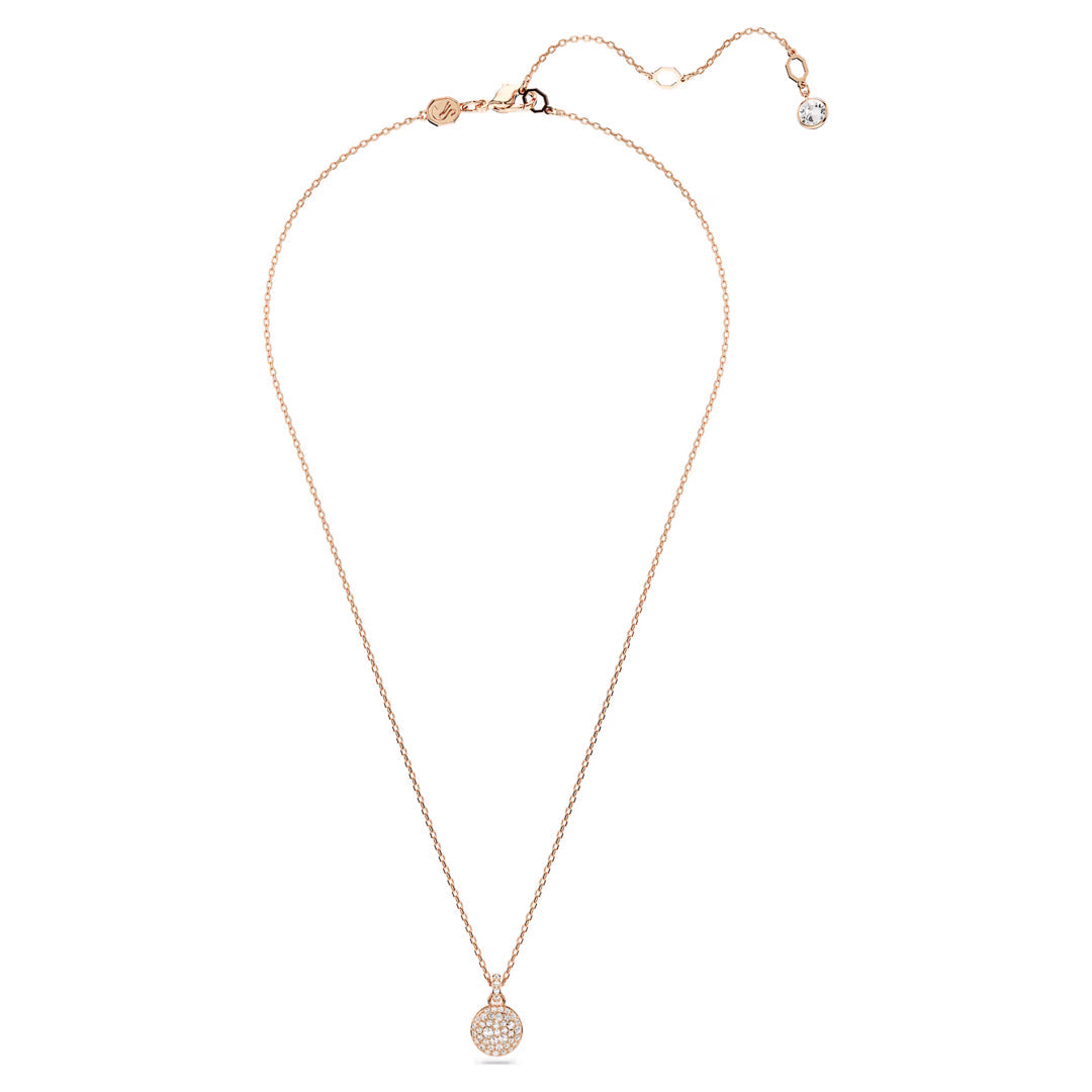 The Swarovski Sublima Necklace Pendant by Swarovski is a delicate rose gold-tone piece featuring a small circular pendant adorned with clear round crystals, attached to a fine chain. The chain includes an adjustable clasp and an additional charming charm at the end.