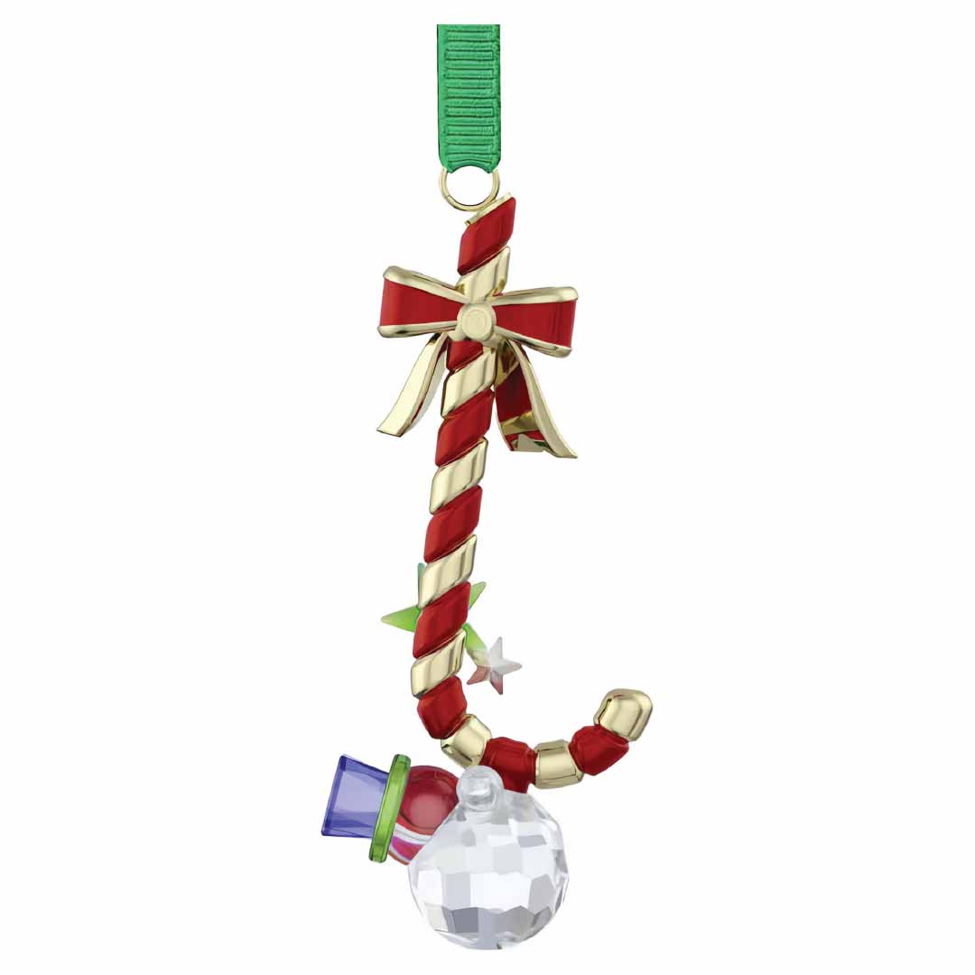 The Swarovski Holiday Cheers Dulcis Candy Cane Ornament Home Décor by Swarovski features festive red and gold stripes, and is elegantly hung with a green ribbon. A gold bow complements its design, along with a blue gem, star accents, and a faceted crystal ball at the bottom, creating a vibrant holiday display.