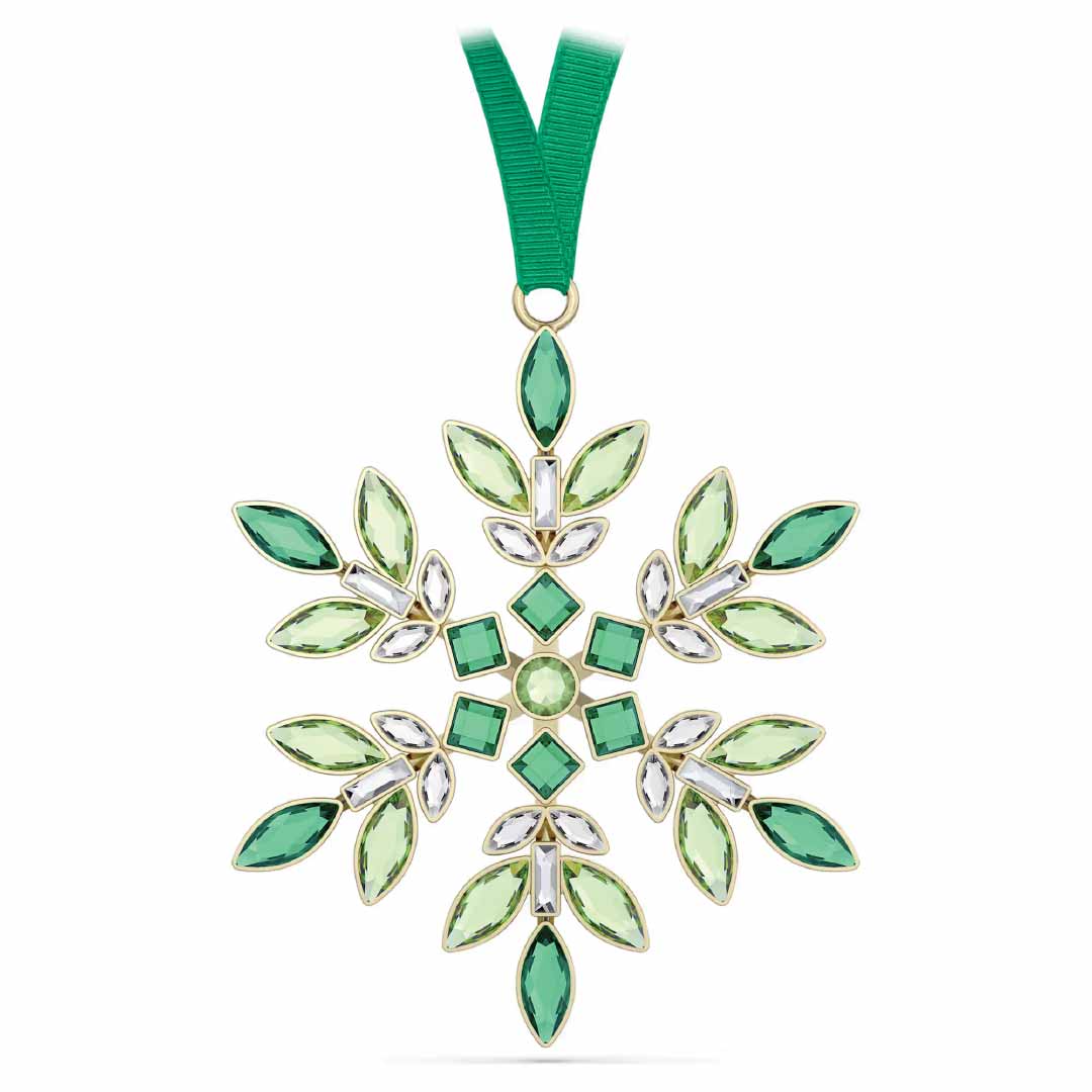 The Swarovski Gema Holiday Ornament Home Décor piece, from the renowned brand Swarovski, is embellished with green and clear gemstones, crafting a stunning holiday decoration. Suspended from a green ribbon, it gleams with the radiant brilliance of Swarovski crystals arranged in an impeccably symmetrical pattern.