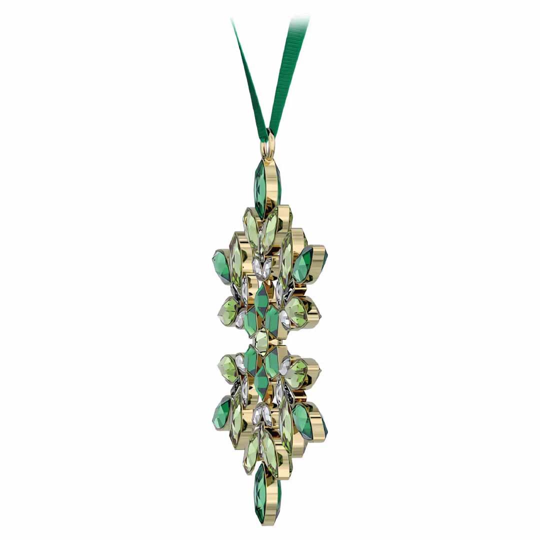 Introducing the Swarovski Gema Holiday Ornament Home Décor: a luxurious, gold-toned pendant inspired by Gema snowflake designs. This exquisite piece features Swarovski crystals in vibrant green and clear tones, crafted into an elegant pattern. It gracefully hangs from a green ribbon, offering a sophisticated and radiant holiday decoration.