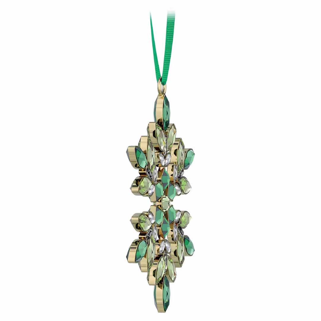 A holiday ornament from Swarovski, known as the Gema Holiday Ornament, showcases a gold and green geometric pattern adorned with Swarovski crystal accents and is suspended by a green ribbon. Its design echoes the starburst brilliance of the exquisite Gema snowflake ornaments.