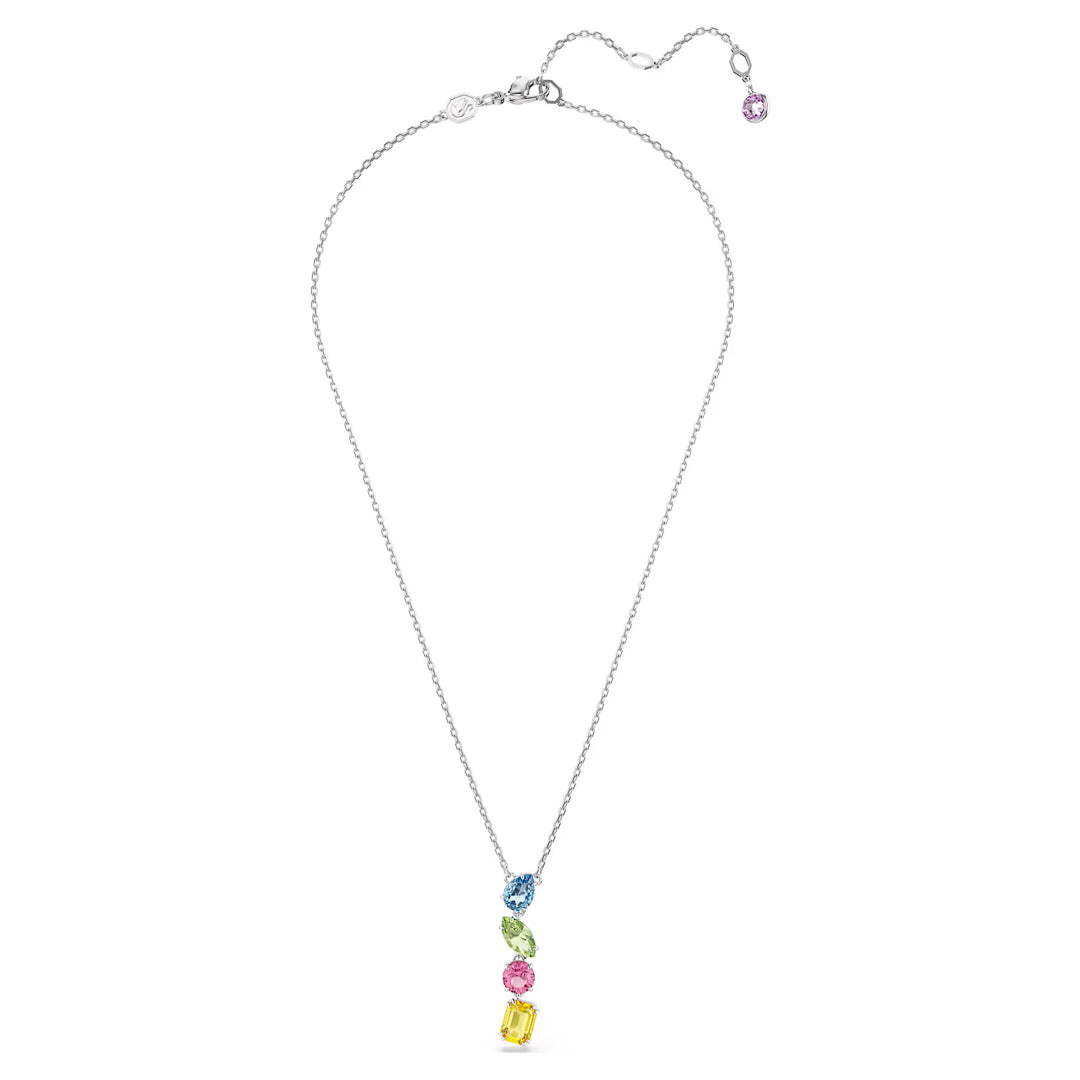 The Swarovski Gema Multicoloured Y Necklace Pendant showcases a silver chain with a striking pendant featuring four vibrant, rectangular Swarovski crystals in pink, yellow, green, and blue arranged vertically at the center. This necklace from the Gema family collection includes an adjustable clasp embellished with a small pink crystal on the extension.