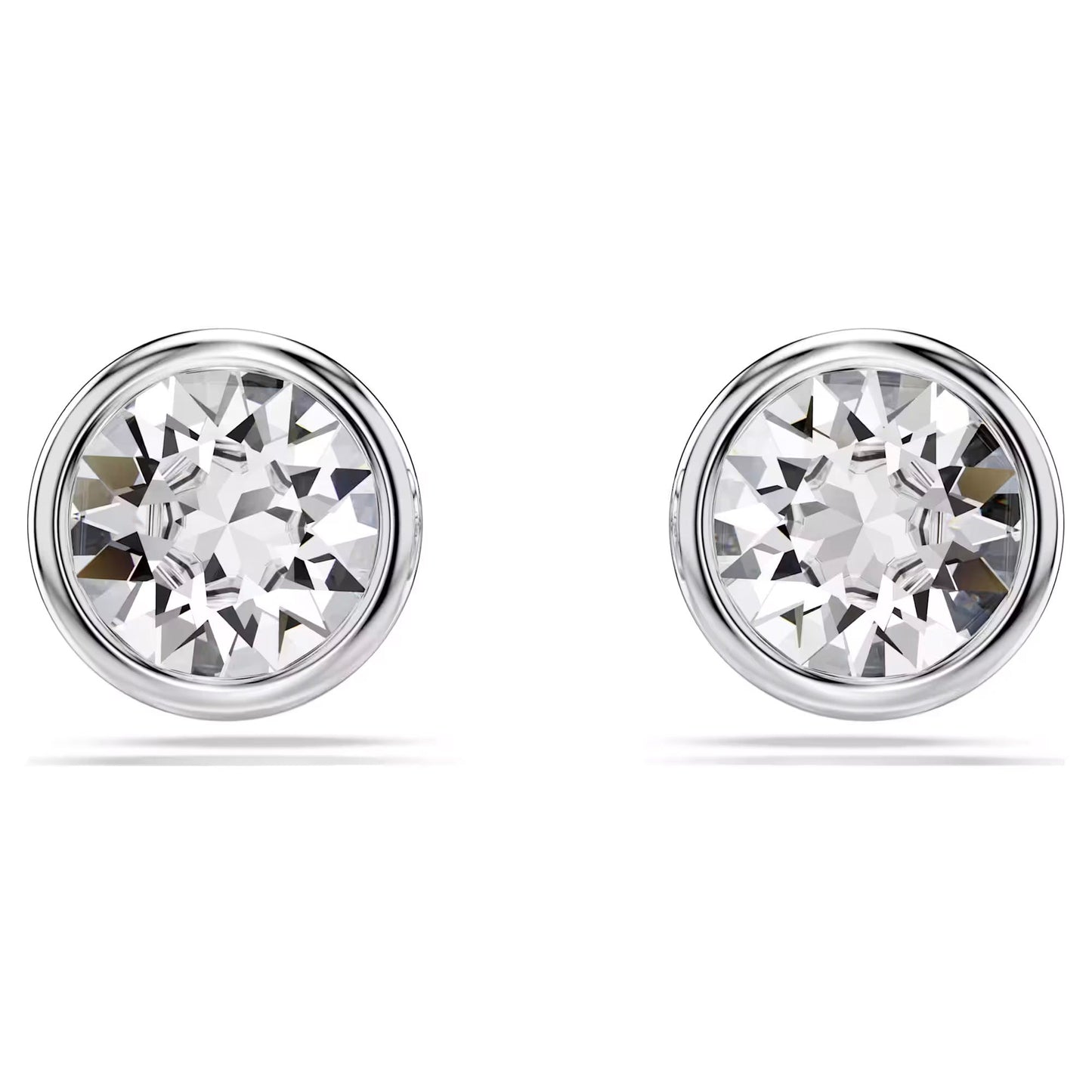 The Swarovski Imber Stud Earrings are a pair of round, rhodium-plated silver studs adorned with large, clear gemstones that reflect light brilliantly. These crystal earrings showcase a simple and elegant design, echoing the timeless elegance of classic Swarovski pieces.