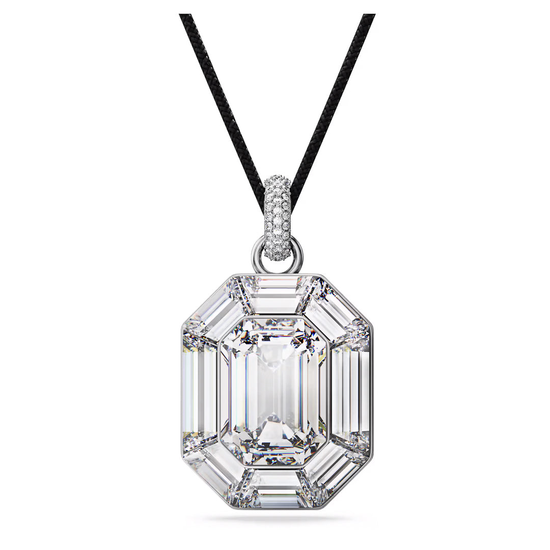 Introducing the Swarovski Lucent Necklace Pendant, a stunning piece from the renowned brand Swarovski. This necklace showcases a brilliant emerald-cut centerpiece diamond framed by glistening octagon-cut crystals. The pendant is elegantly suspended on a sleek black cord, exuding both sophistication and luxury.