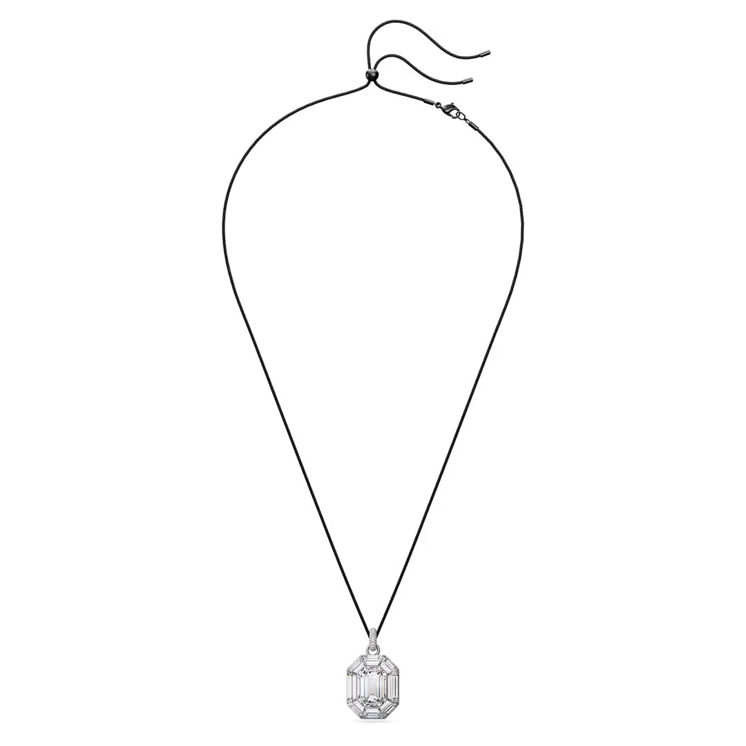 A minimalist Swarovski Lucent Necklace Pendant features a black cord and a striking octagon-cut crystal pendant at its center. The crystal's clear facets catch the light beautifully as it rests on a plain white background.