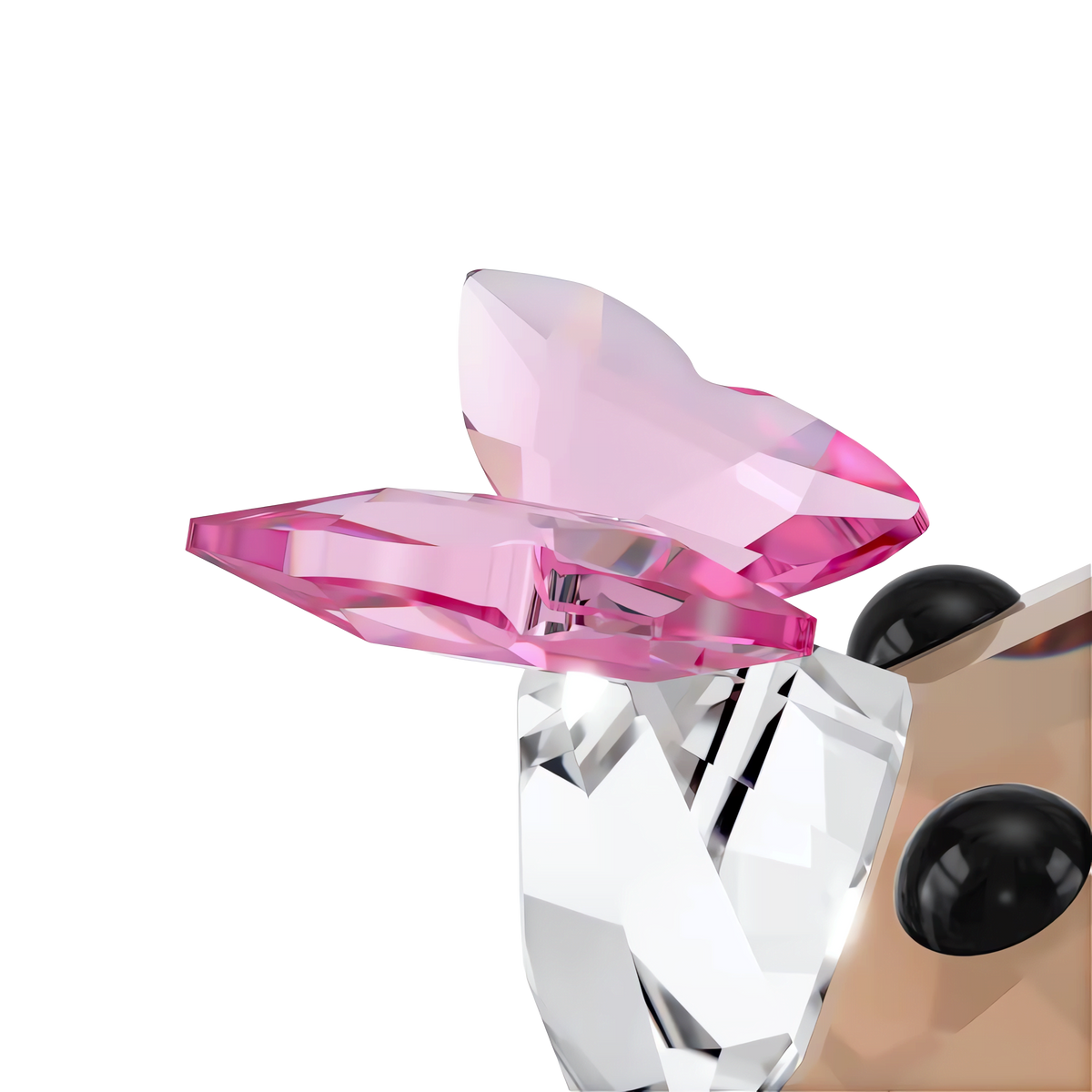 A close-up of the Swarovski Idyllia Fox and Butterfly sculpture from Swarovski’s Idyllia decoration collection, featuring pink crystal ears, black eyes, and a clear body that captures the delicate charm of both a fox and butterfly—presented against a plain white background.