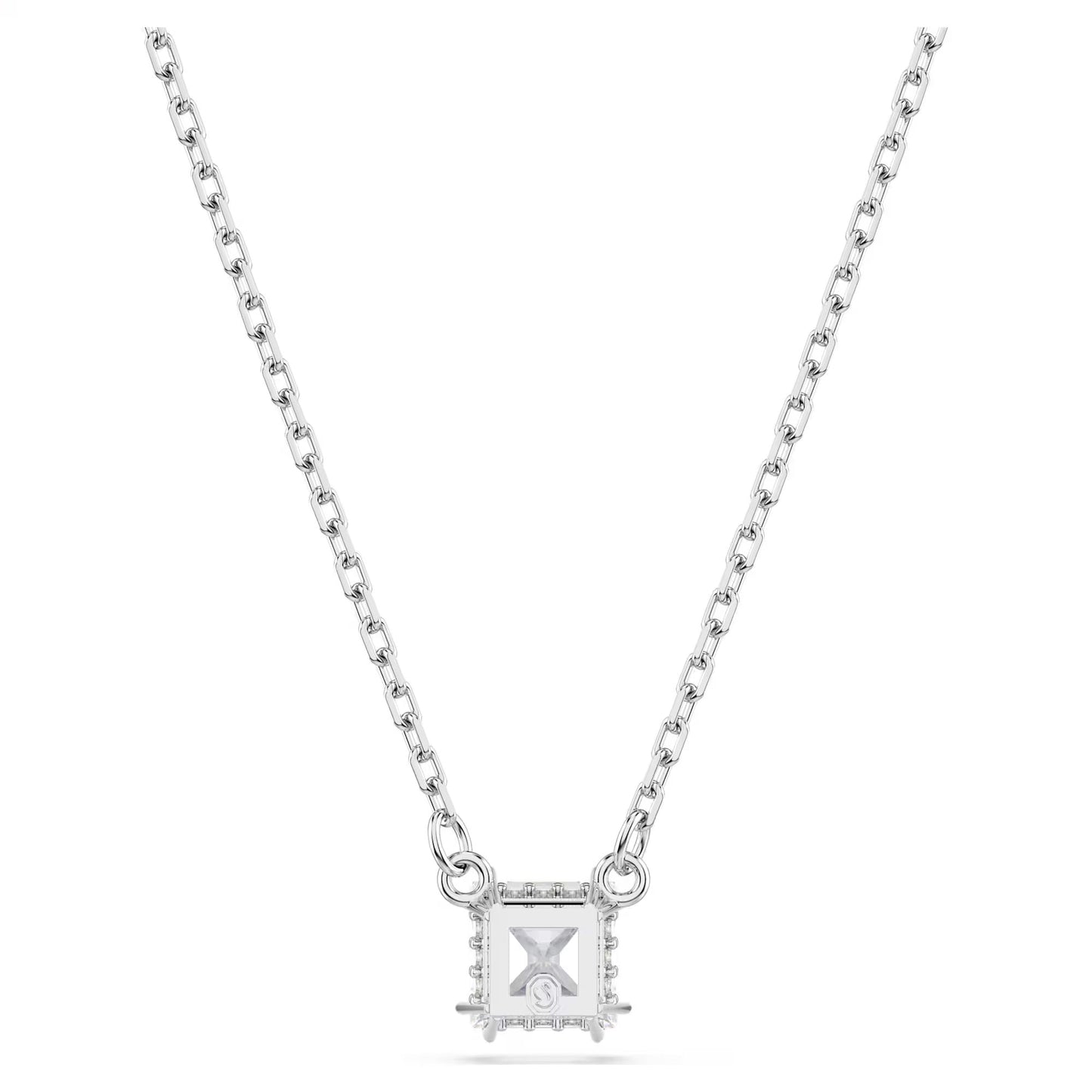 The Swarovski Stilla Attract Square Cut Necklace Pendant, crafted by Swarovski, features a delicate silver chain that highlights a rectangular, rhodium-plated pendant. This pendant is adorned with a central hourglass design set against a clear background and elegantly bordered by small Swarovski Zirconia stones.