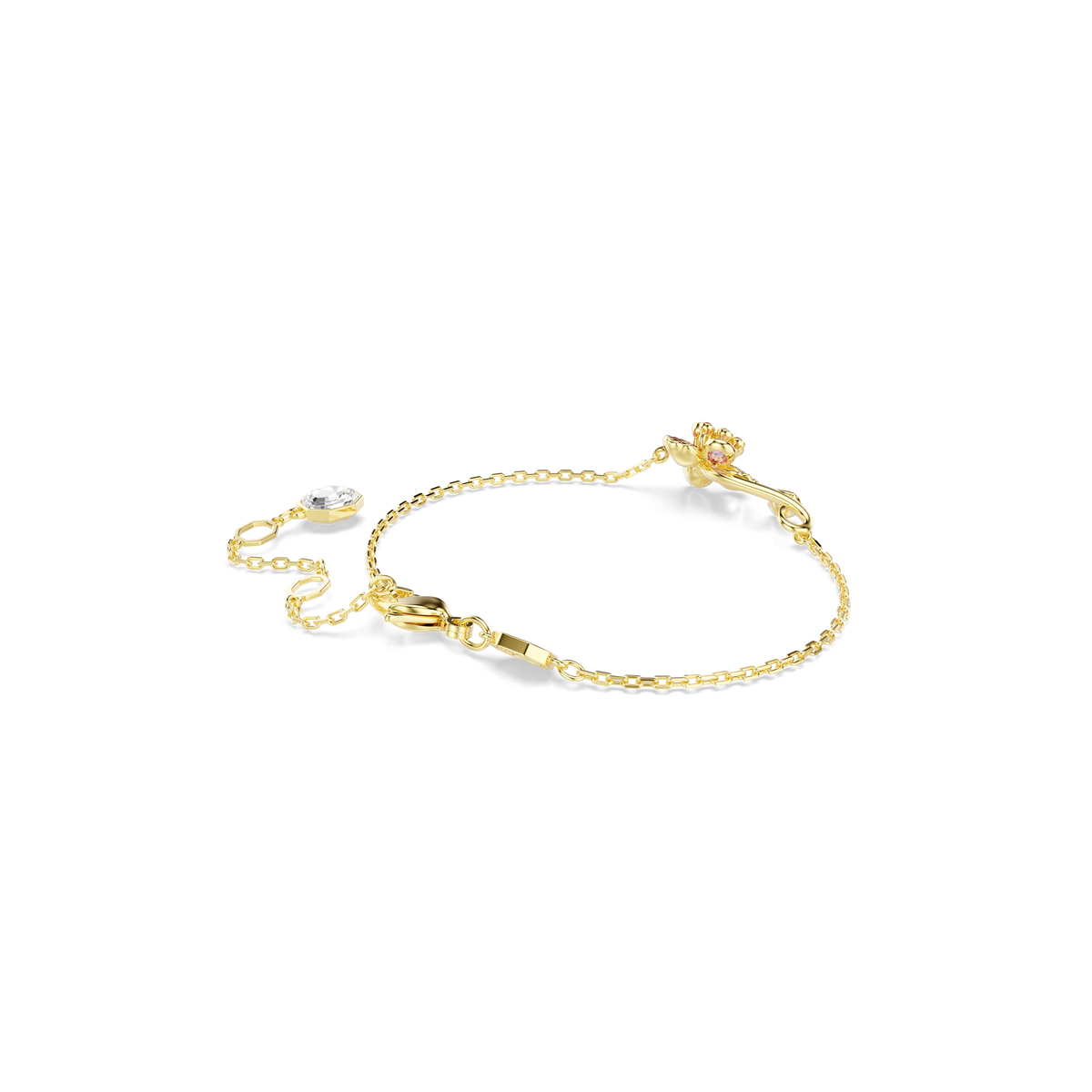 The Swarovski Idyllia Bracelet XS MUL/GOS M by Swarovski features a delicate gold chain adorned with a small, flower-shaped charm and sparkling gemstone accents, shown against a plain white background—a timeless accessory available at Raffi Jewellers.