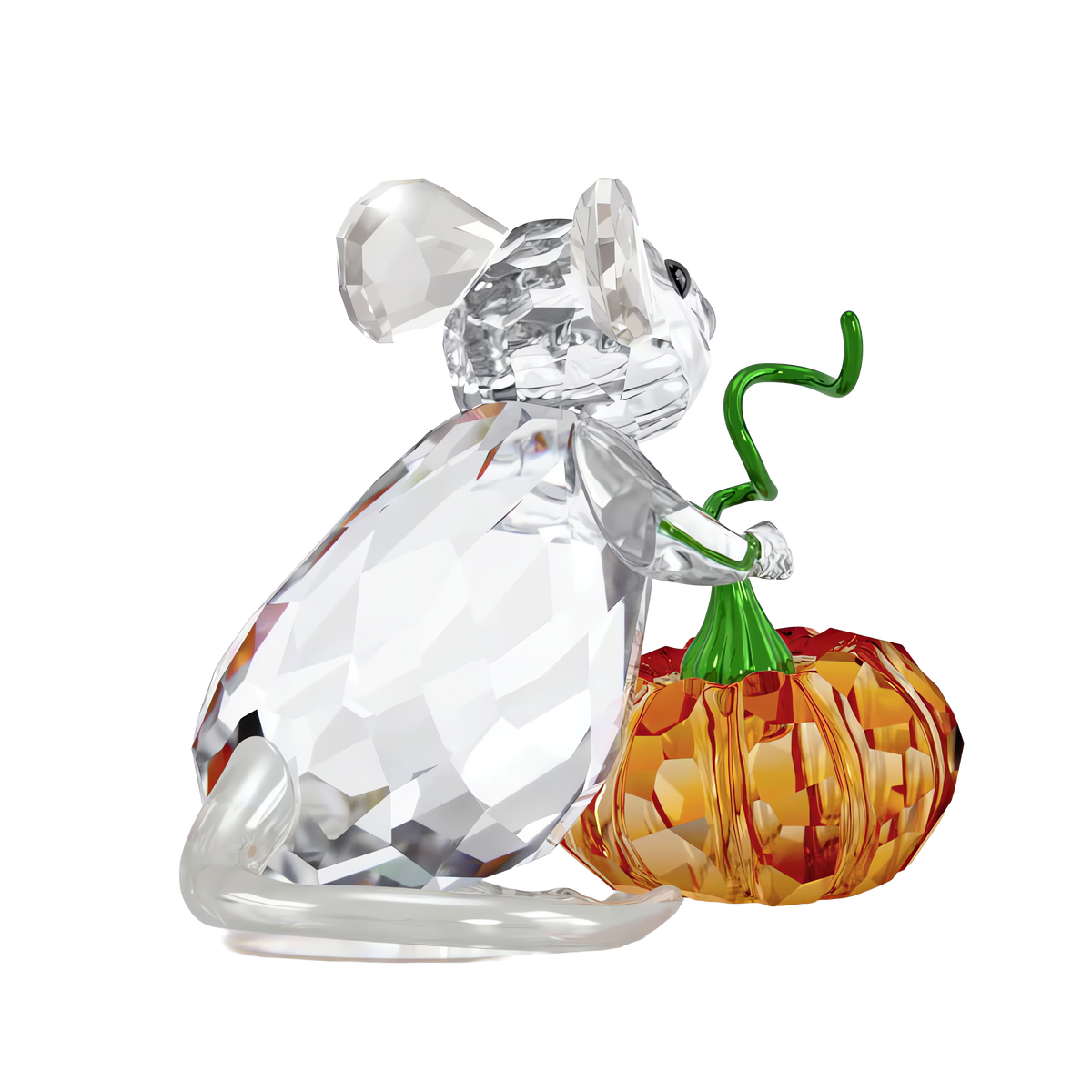 The Swarovski Idyllia Mouse and Pumpkin by Swarovski features a faceted crystal mouse figurine holding a small orange pumpkin with a green stem, making it a charming addition to your Halloween display or as a festive pumpkin decoration, set against a white background.