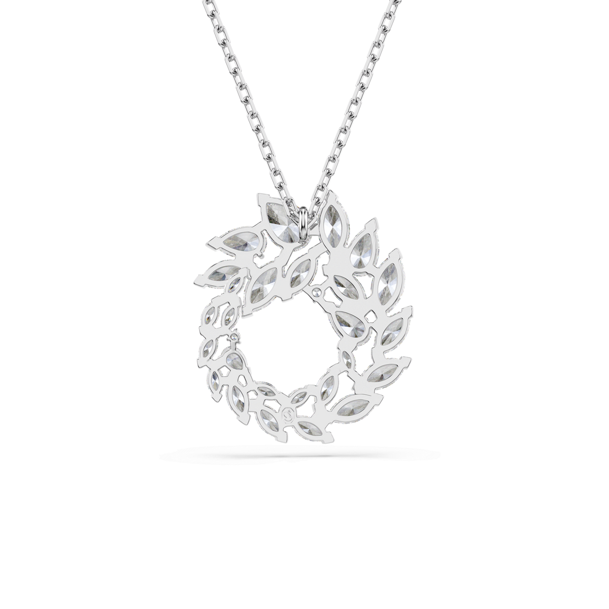 Swarovski Mesmera pendant featuring a marquise-cut white Swarovski Zirconia, elegantly set on a rhodium-plated circular pendant with interwoven leaf-inspired shapes, suspended from a delicate chain and showcased against a white background.