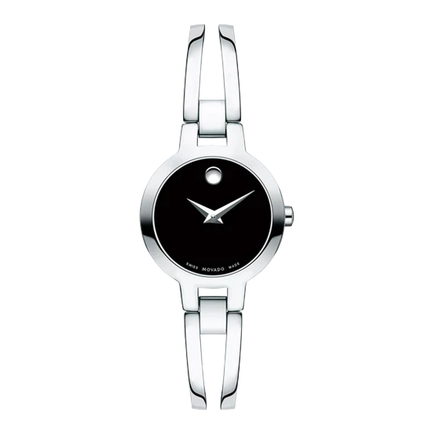 The Movado Amorosa Quartz 24mm Watch by Movado is a sleek silver wristwatch featuring a minimalist black dial with a single dot at the 12 o'clock position and an elegant, slim bracelet-style strap.