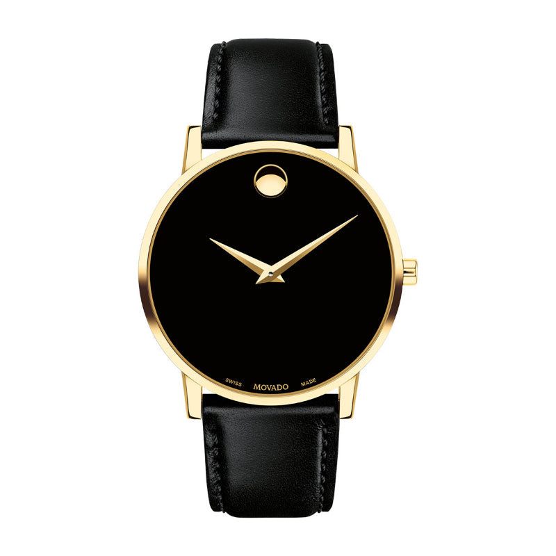 An elegant wristwatch showcasing a yellow gold PVD case and a minimalist black dial, marked by a single golden dot at the 12 o'clock position alongside two slender hands. The black leather strap enhances its classic appeal, capturing timeless elegance in this Movado Museum Classic Quartz 40mm Watch.