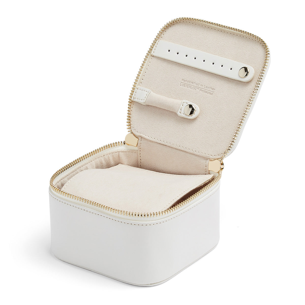 As part of WOLF's Maria collection, the WOLF 1834 Zip Jewellery Cube boasts a white leather exterior with a beige interior and a zippered closure. Its open design includes versatile compartments and a strap for securing items, enhanced with LusterLoc™ technology to protect your valuable pieces.