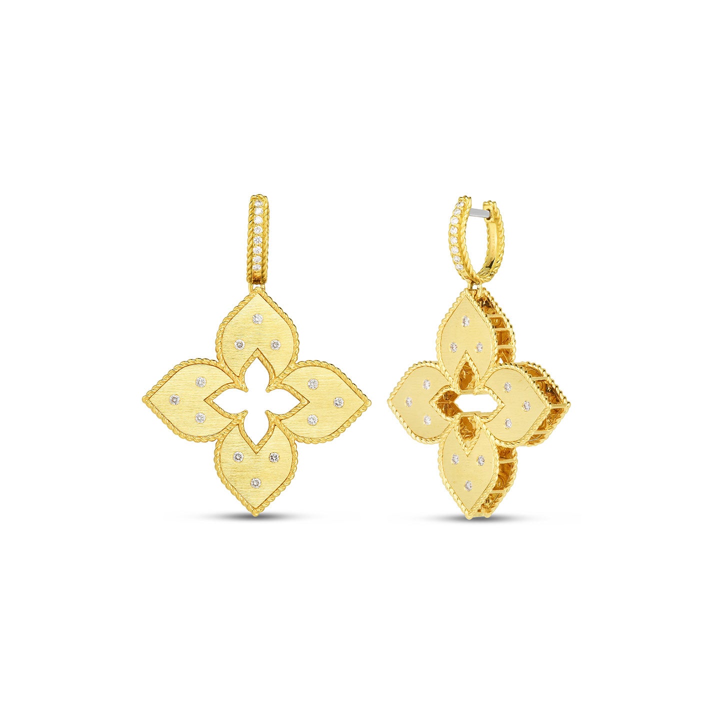 The Roberto Coin Venetian Princess 18K Yellow Gold Diamond Earrings are intricately designed earrings featuring delicate diamond accents in the shape of four-petal flowers. These earrings, reminiscent of a Venetian Princess, showcase textured petals and are complemented by thin hoops for wearing. The background is white.