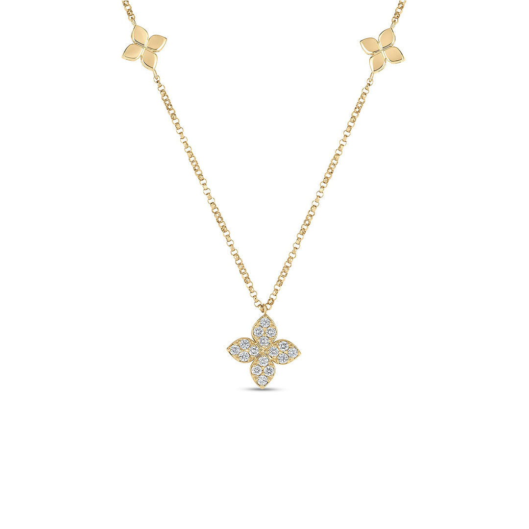 The Roberto Coin Diamonds by the Inch 18K Yellow Gold Diamond Station Flower Necklace Pendant features a central pavé flower with diamond accents and two polished flowers on each side, shown against a white background.