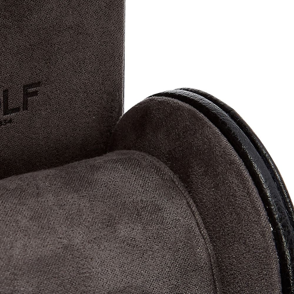 Close-up of a dark gray suede shoe highlights its texture, stitching, and sole edge. A subtle black embossed logo on the upper reflects the refined craftsmanship found in the WOLF 1834 British Racing Single Watch Roll by WOLF.