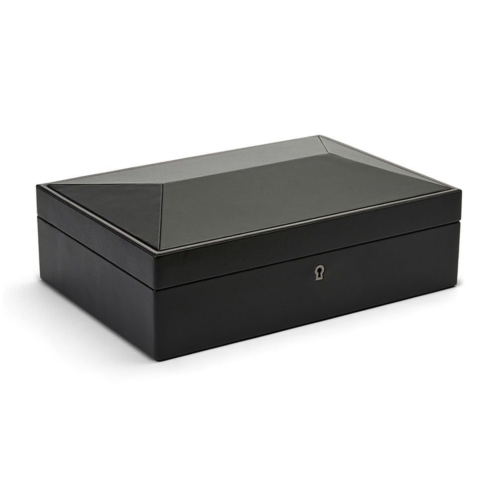 The WOLF 1834 British Racing 10 Piece Watch Box, featuring a closed black vegan leather design with a glass top and small keyhole at the front, sits against a plain white background, offering elegant watch storage.