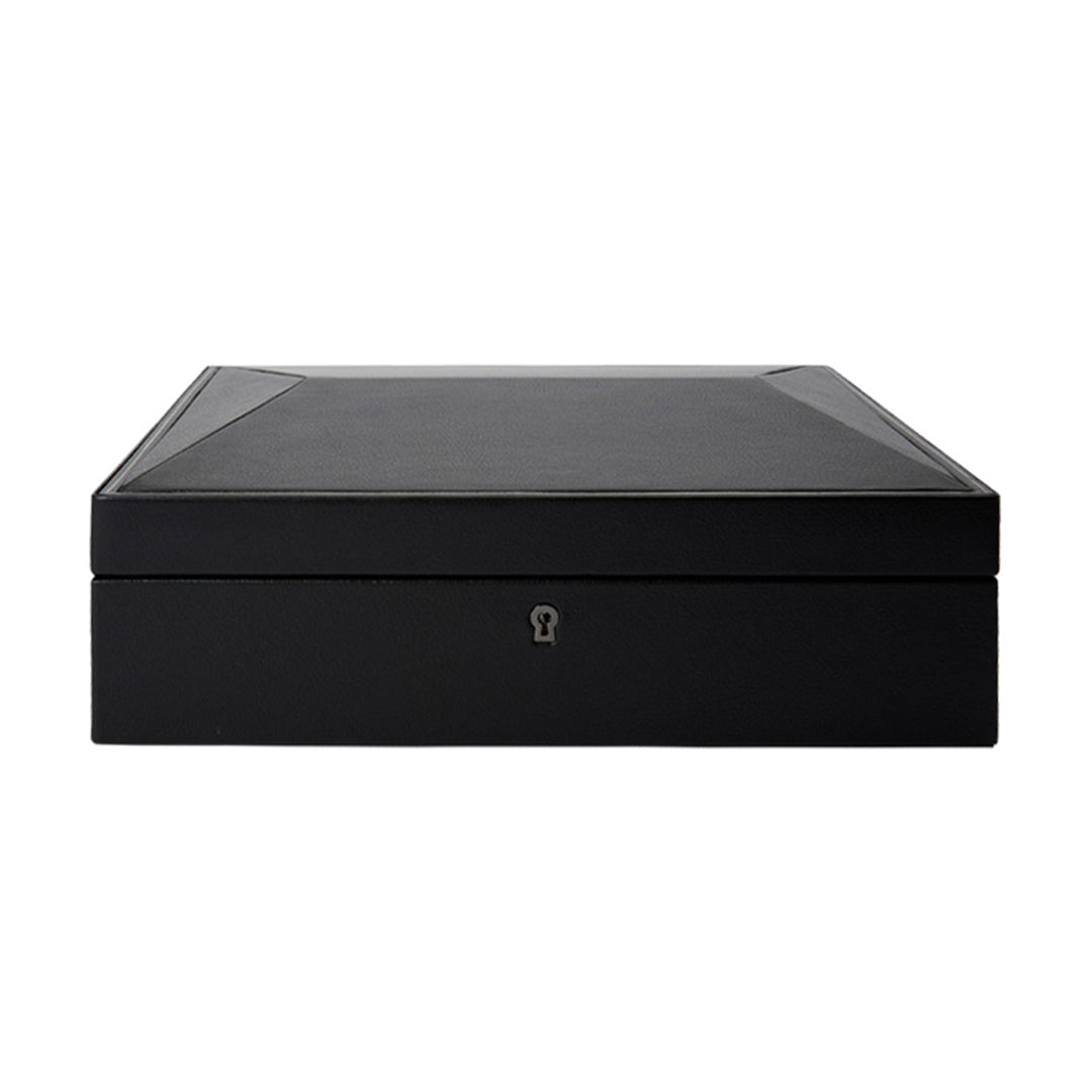 The WOLF 1834 British Racing 15 Piece Watch Box by WOLF is a sophisticated black rectangular case, crafted from vegan leather with a smooth surface and subtle detailing on the edges. It features a keyhole on the front for lock and key security, making it ideal for elegantly storing watches while perfectly balancing modern design with functionality.