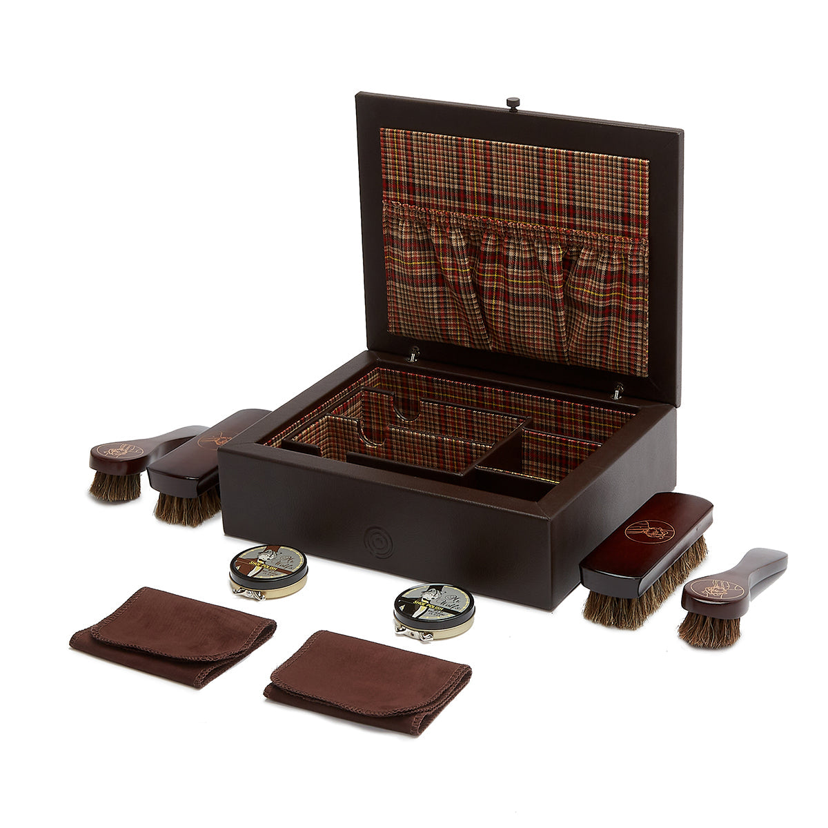 Explore the WOLF 1834 WM Brown Shoe Shine Case, a luxurious shoe care kit elegantly presented in a sophisticated dark wooden box with a Negroni tweed interior. The set includes wooden-handled brushes, two tins of polish, and polishing cloths, all meticulously organized to enhance its elegant charm. Ideal for the discerning gentleman's shoe shine collection.