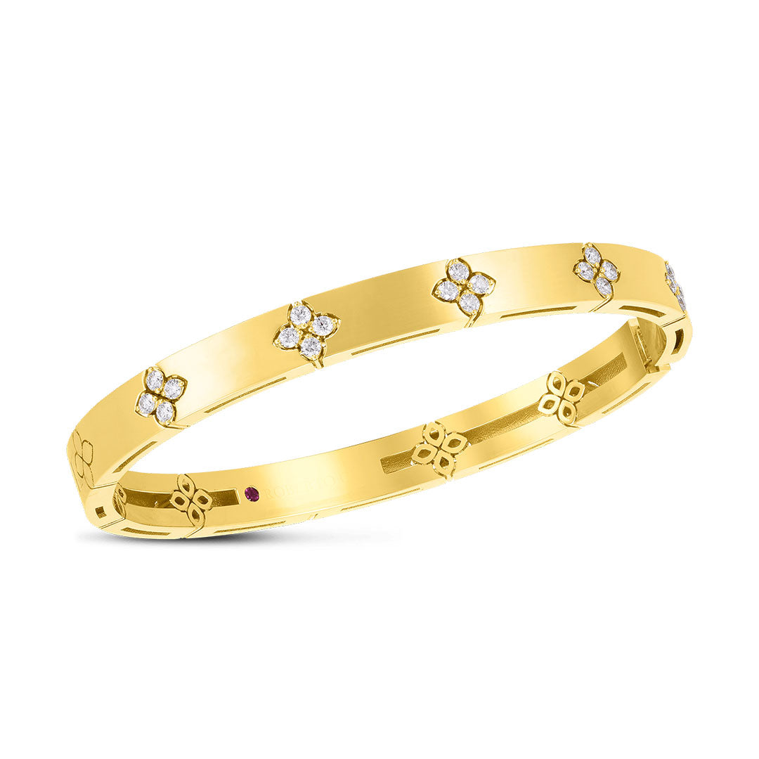 The Roberto Coin Love In Verona 18K Yellow Gold Medium Width Diamond Accent Bangle features a polished 6mm band with evenly spaced diamond floral clusters totaling 0.45 TCW and subtle engraved floral motifs along the bracelet.