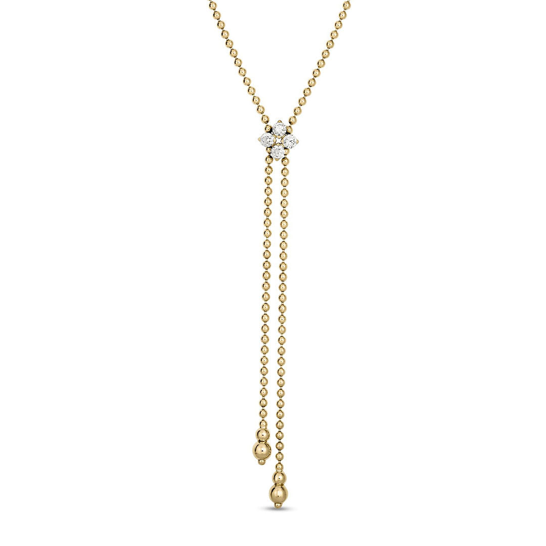 The Roberto Coin Love in Verona 18K Yellow Gold Diamond Flower Lariat Necklace features a 23" Y-shaped chain with a central cluster of three diamonds (0.30 tcw) and two dangling ends, each accented with a small gold bead.