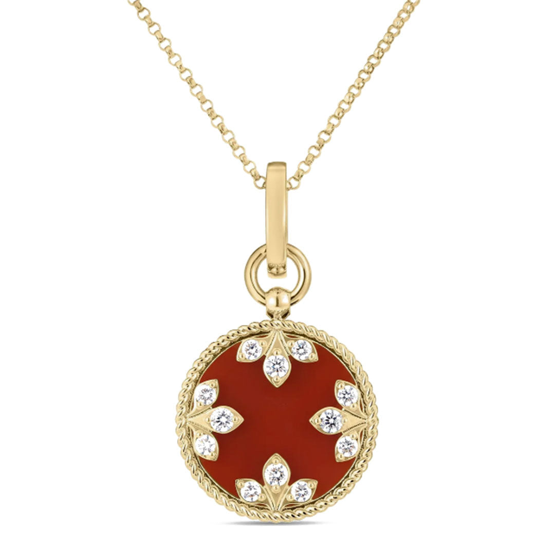 The Roberto Coin Venetian Medallions 18K Yellow Gold Medium Necklace Pendant features a round red agate center with diamond accents, crafted with a rope-style edge in an elegant floral motif.