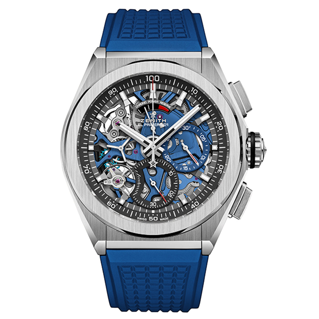 The ZENITH Defy El Primero 21 by Zenith is a luxury wristwatch with a blue strap and exposed gears. It features sub-dials, a tachymeter bezel, and combines silver, blue, and black in its skeletonized design.