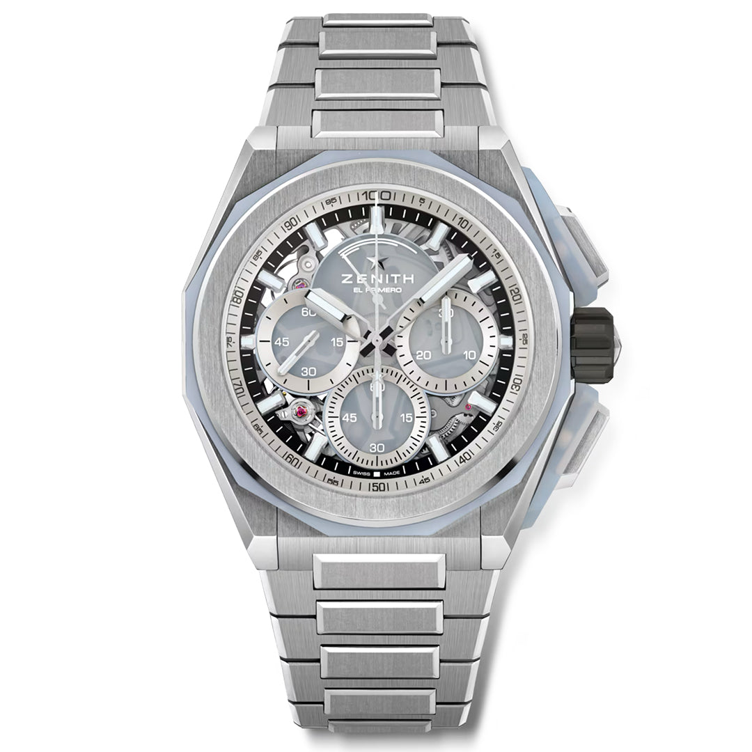 The ZENITH Defy Extreme El Primero 9004 45mm Watch by Zenith showcases a silver design with a chalcedony gemstone, stainless steel bracelet, blue accents, and skeleton face. It features intricate gears, a titanium chronograph with three sub-dials and tachymeter, and an elegantly placed brand logo.