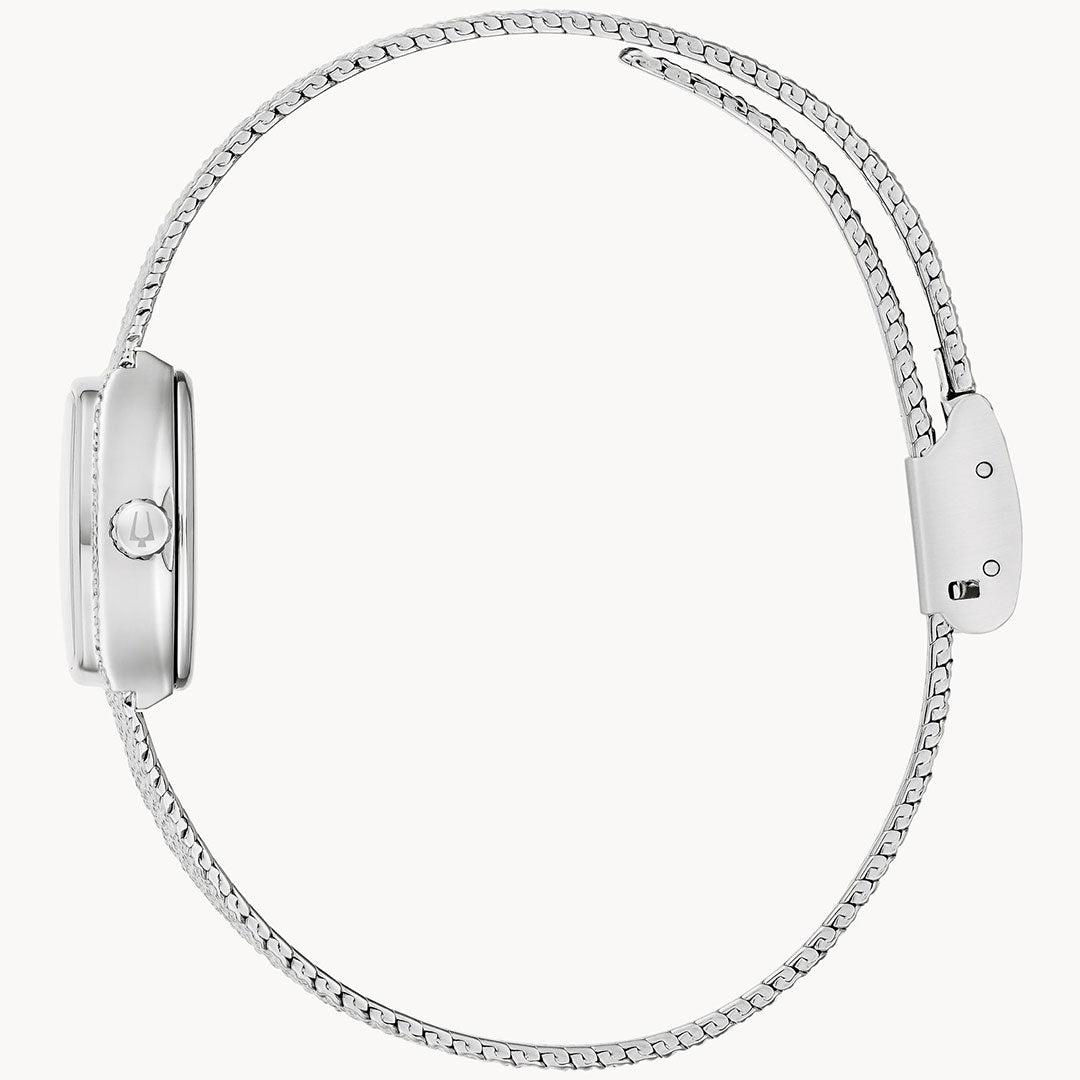 A side view of the Bulova Goddess of Time Quartz 17mm womenâs watch shows its sleek silver design, thin mesh metal band, and minimalist clasp, evoking vintage elegance against a white background.