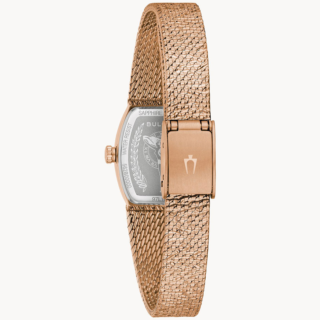 The Bulova Goddess of Time Quartz 17mm women’s watch features a rose gold mesh band with clasp, branded emblem, and a case back engraved with text and logo.