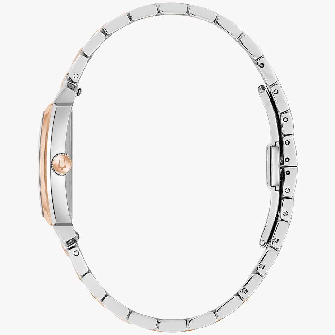 Side view of the Bulova Sutton Quartz 25mm Watch, featuring a slim two-tone silver stainless steel band and a round rose gold crown and bezel, highlighting its minimalist profile and elegant clasp detail.