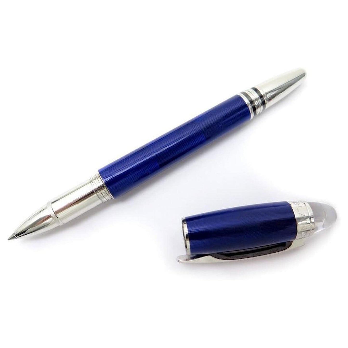 A sleek Montblanc Starwalker Cool Blue Ballpoint Pen with its cap removed lies beside the pen on a white background.