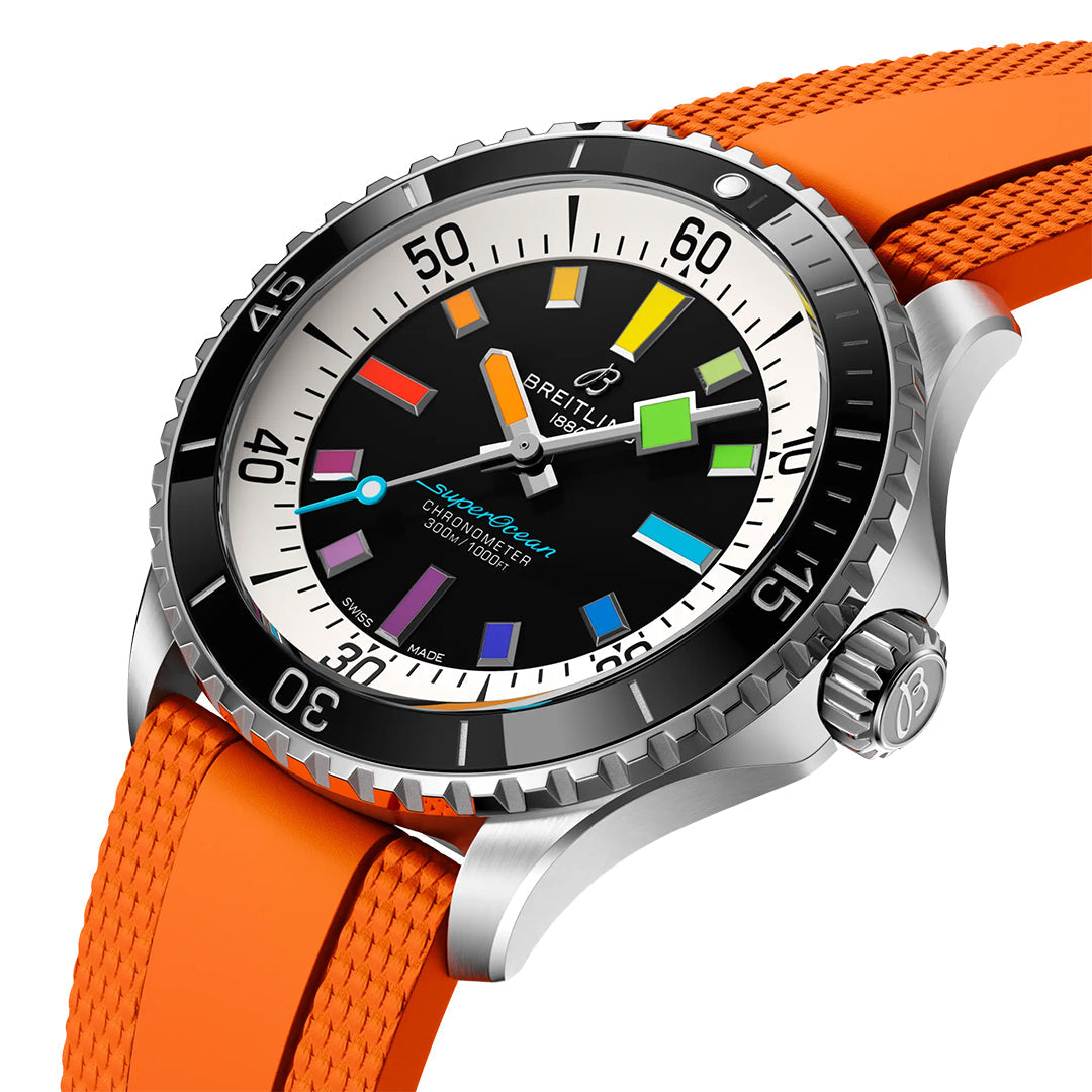 The Breitling Superocean Automatic 42 features a stainless steel case, black dial with colorful luminescent indexes, luminous hands and markers, unidirectional bezel, and an orange textured rubber strap.