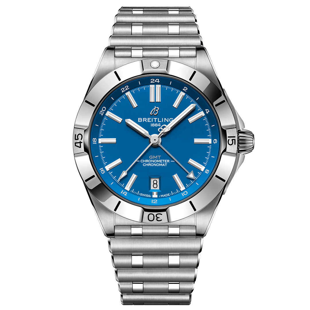 The Breitling Chronomat Automatic GMT 40 features a blue dial, silver hour markers, date window at 6 o’clock, stainless steel case and bracelet, and an engraved numeral bezel for added style.