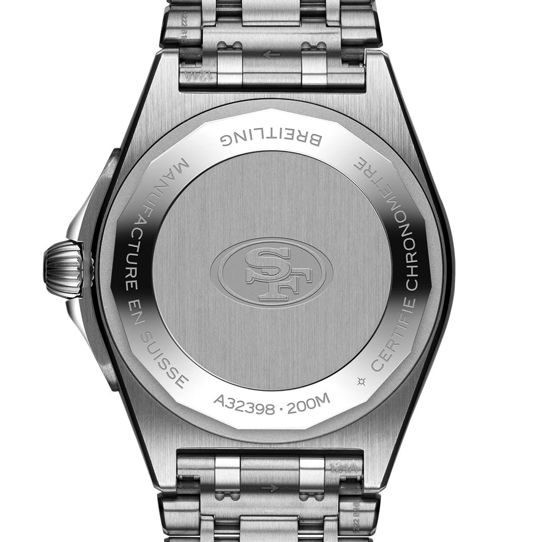 The back of the BREITLING Chronomat Automatic GMT 40 features engraved text, an SF logo for the San Francisco 49ers, “Breitling,” “Manufacture en Suisse,” “Certifie Chronometre,” “A32398 - 200M,” and a stainless steel bracelet.