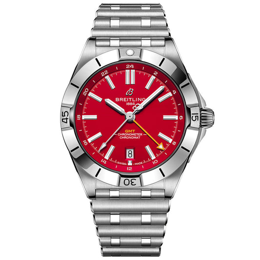 The BREITLING Chronomat Automatic GMT 40 features a stainless steel case, bright red dial, silver hour markers, date window at 6 o’clock, metal link bracelet, and a bezel with minute indicators.