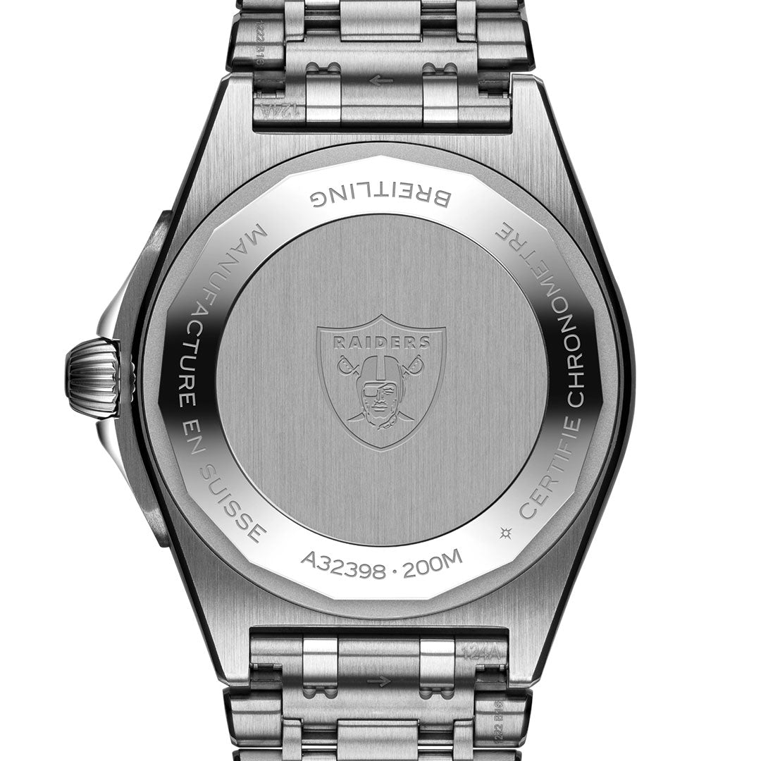 The back of the BREITLING Chronomat Automatic GMT 40 showcases an engraved Las Vegas Raiders logo at the center, encircled by "BREITLING," "MANUFACTURE EN SUISSE," "A32398," "200M," and "CERTIFIE CHRONOMETRE.