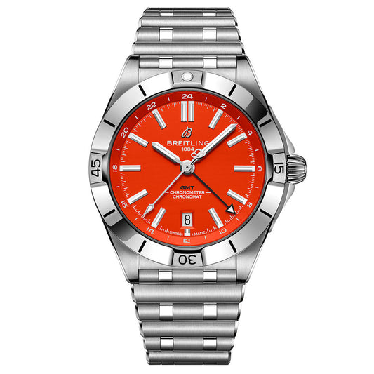 The BREITLING Chronomat Automatic GMT 40 features a stainless steel case, vivid orange dial, silver markers, and date at 6 o’clock—ideal for Cincinnati Bengals fans—shown on a metal link bracelet against a white background.