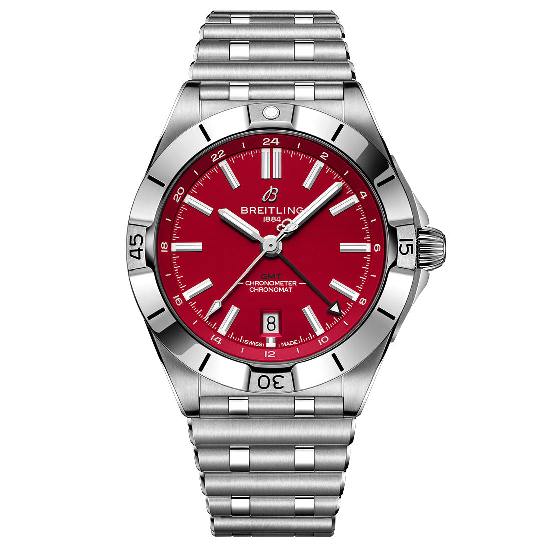 The BREITLING Chronomat Automatic GMT 40 features a stainless steel case, bright red dial with silver markers and hands, date at 6 o’clock, metal link bracelet, and a bezel with minute indicators.