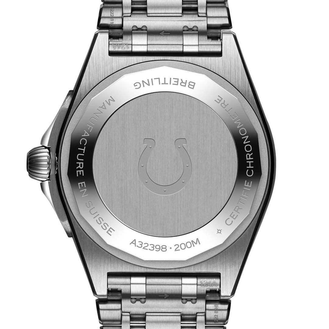 The back of the stainless steel Breitling Chronomat Automatic GMT 40 displays engraved model and water resistance info, a central Indianapolis Colts-inspired horseshoe symbol, and comes with a metal bracelet.