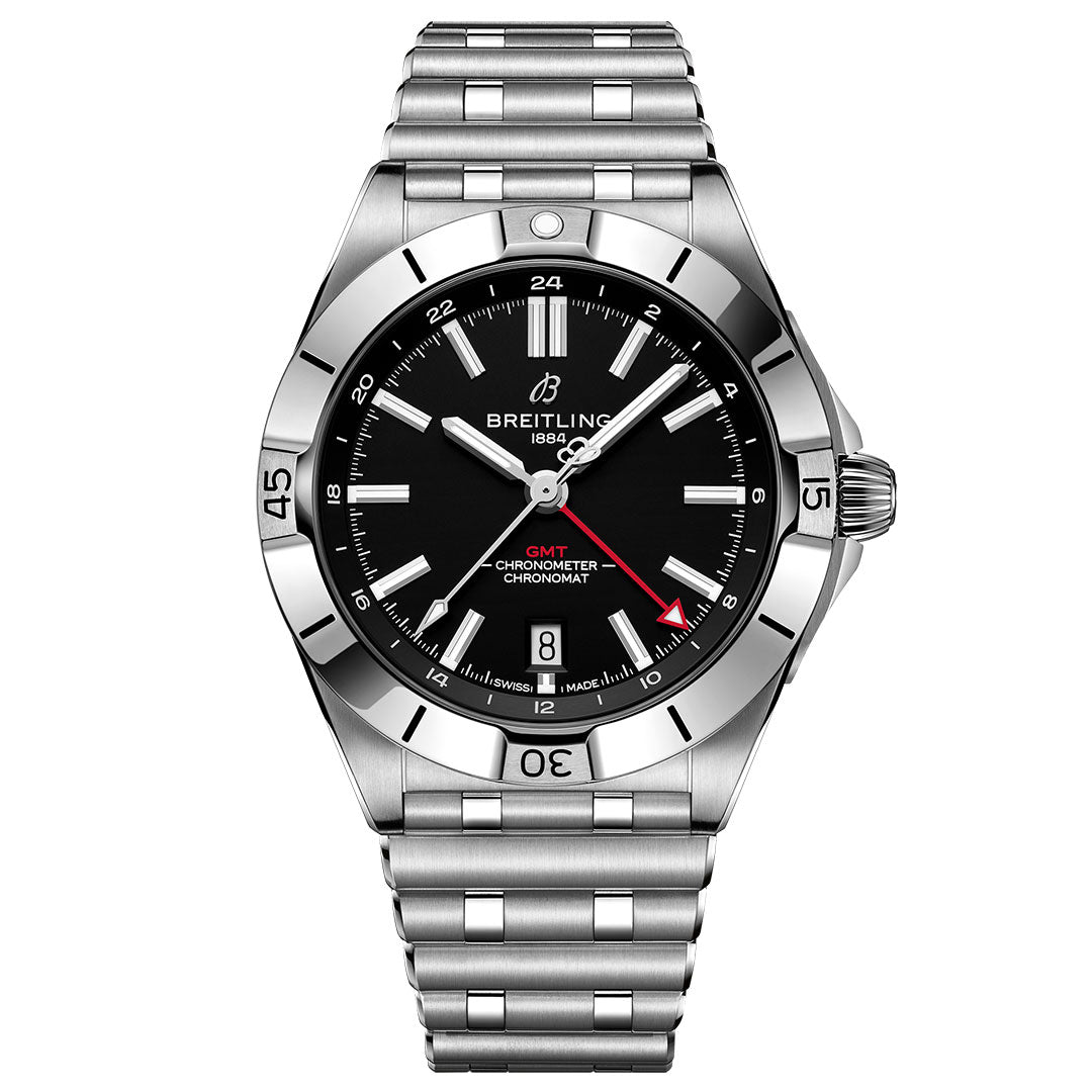 The BREITLING Chronomat Automatic GMT 40 features a stainless steel case, black dial, date at 6 o'clock, silver hour markers, red GMT hand, and metal link bracelet. Its silver bezel has black markings.