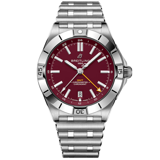 The BREITLING Chronomat Automatic GMT 40 features a stainless steel band, deep red dial with silver hour markers, date window at 6 o’clock, and Washington Commanders logo and branding below 12 o’clock.
